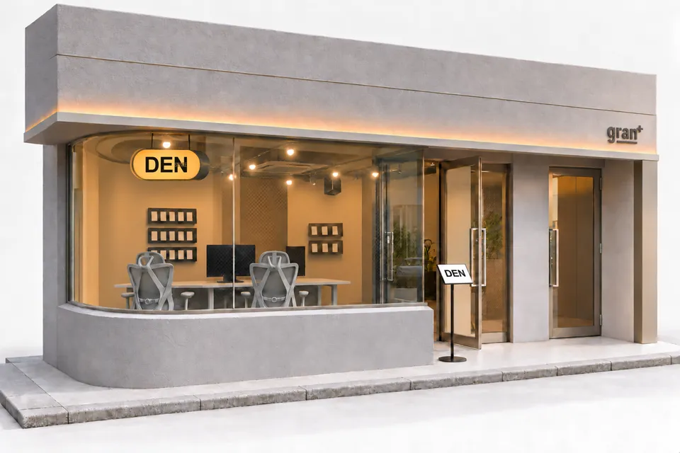 DEN STORE秋葉原の店舗外観。大きなガラス窓の中にテーブルとカードの展示が見える